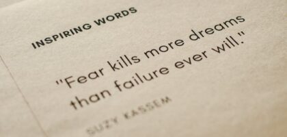 close up shot of inspiring words on a brown paper