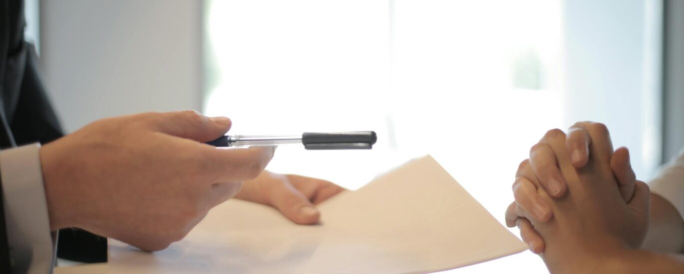 crop businessman giving contract to woman to sign