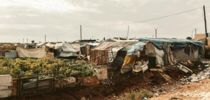 temporary shelters in refugee camp landscape